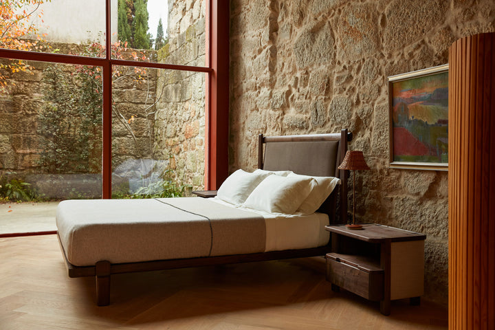 TWENTY-FIVE UPHOLSTERED BED